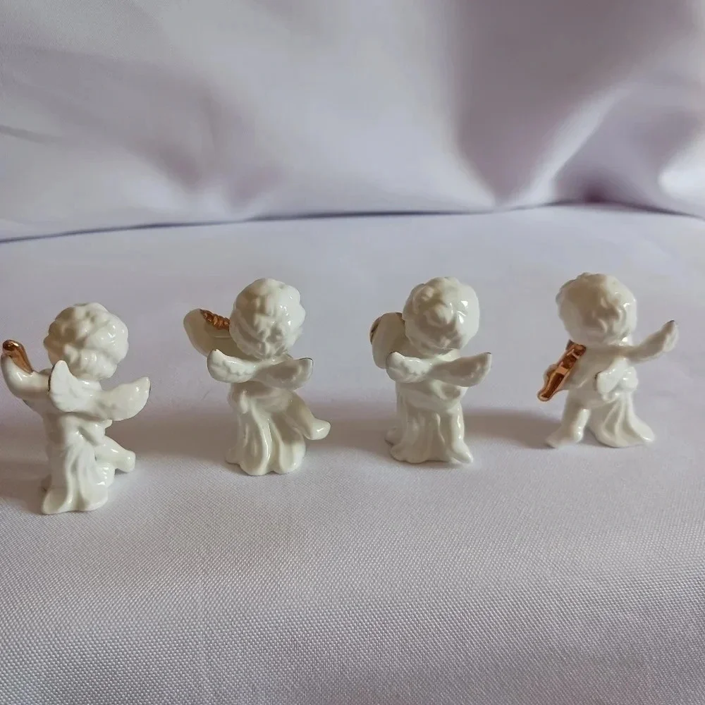 Bone china set of 4 angels gathered playing instruments